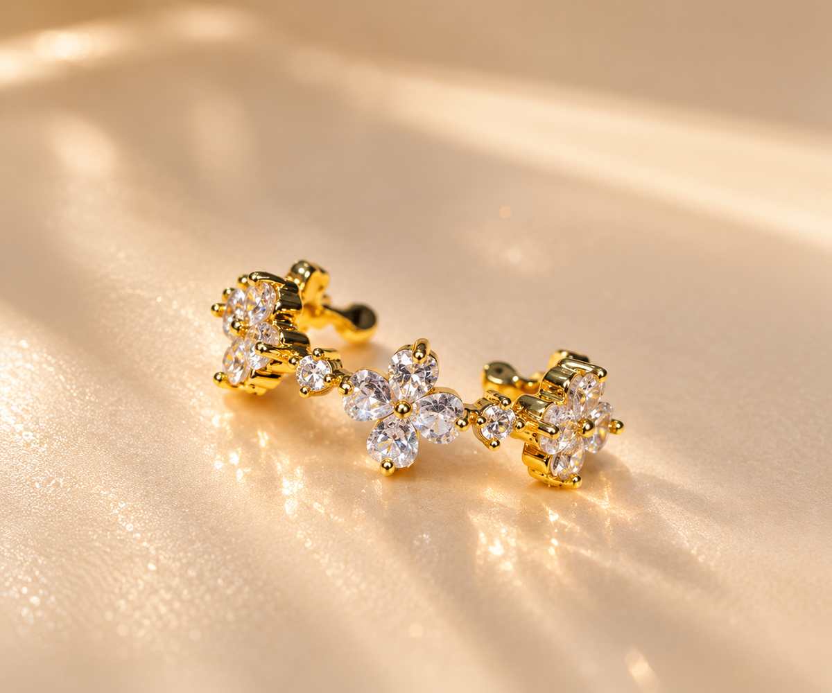 Gold-plated floral ring with clear decorative accents